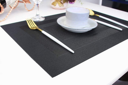 PIGCHCY Placemats,Washable Vinyl Woven Table Mats,Elegant Durable Placemats for Dining Table Set of 4 (18 x 12 inches, Pure Black)