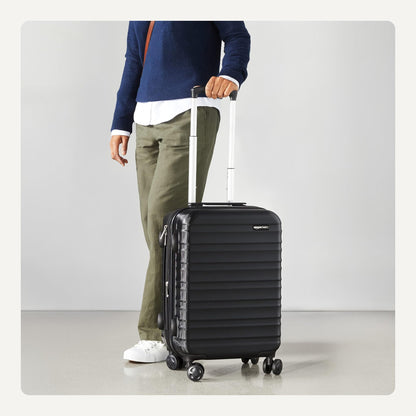 Amazon Basics 21" Hardside Carry-On Luggage, Hardshell Suitcase With Wheels, Expandable For Up to 25% More Space, With Scratch-Resistant Surface, Four Multi-directional Wheels, Black