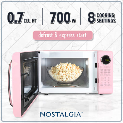Nostalgia Retro Microwave Oven 0.7 Cu Ft, 700-Watt Countertop Size with Glass Turntable, Child Safety Lock, 8 Auto-Cook Programs, Digital Clock, Pink