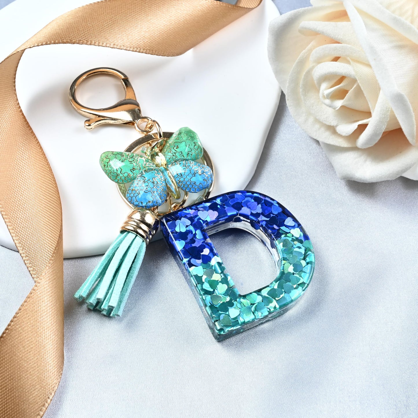 JINGUAZI Initial letter Keychains for Women Tassel Butterfly Pink Purple Cute Car Keychain for Wallet Backpack bag charm (D-Blue Green)